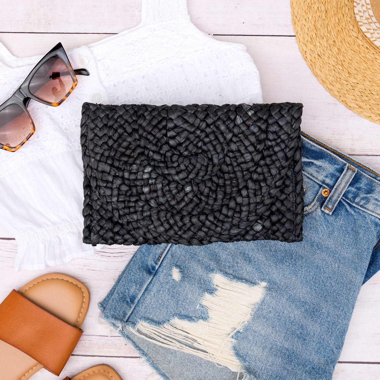 Foldover Straw Clutch in natural and black