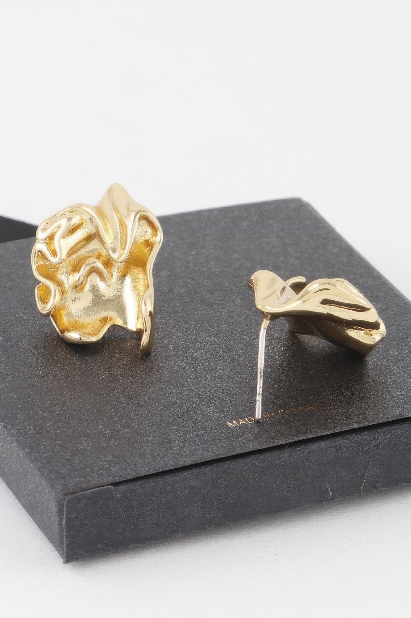 Ripple In Time Earrings in gold and silver