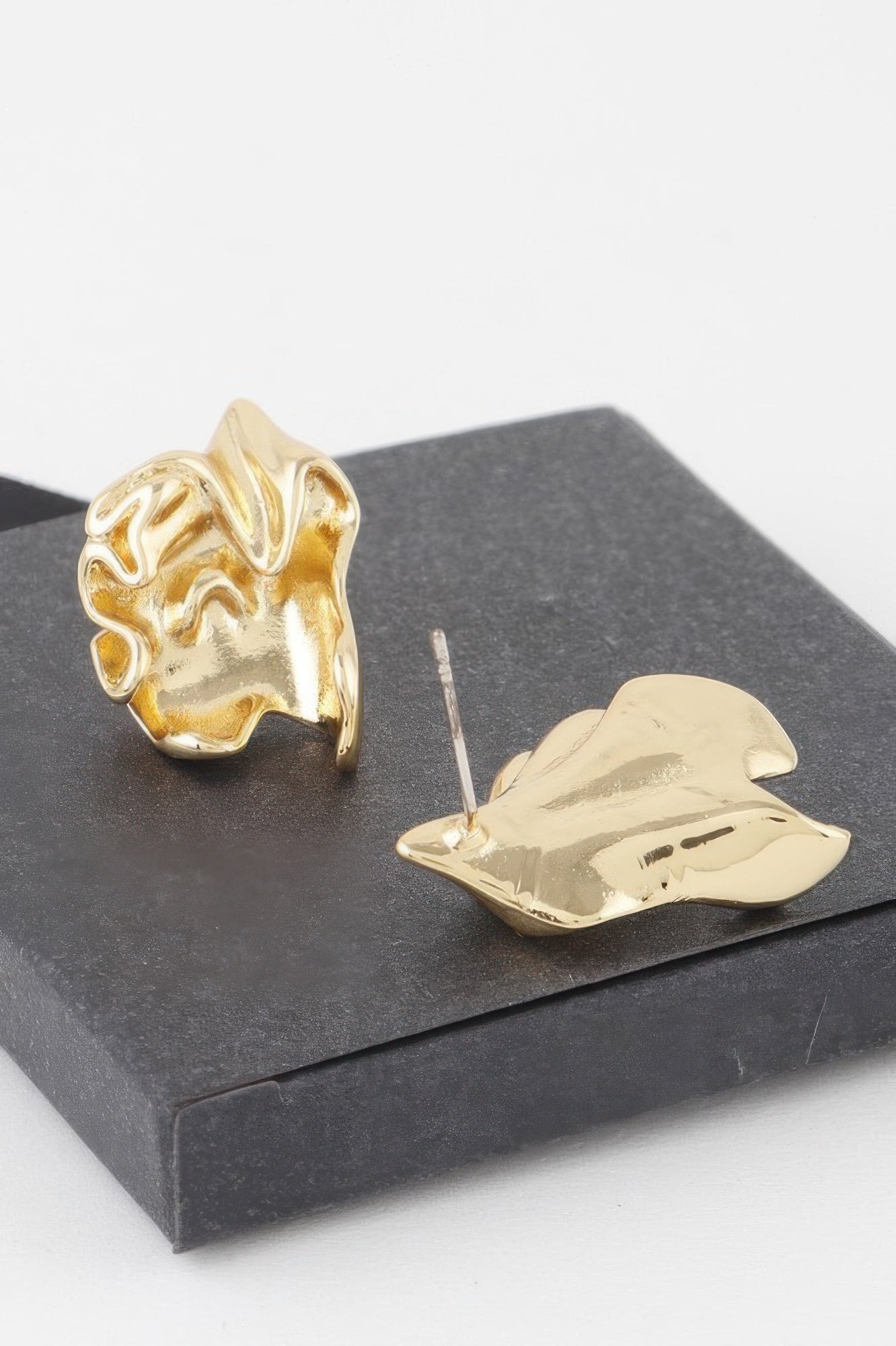 Ripple In Time Earrings in gold and silver